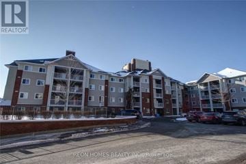 Toronto (Agincourt North) condo for rent - A large apartment complex with multiple buildings and cars parked in the lot.