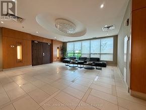 Toronto (West Humber-Clairville) condo for rent - A spacious living room with a large window and a view of greenery outside.