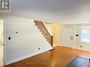 Augusta apartment for rent - A room with a staircase and a door.