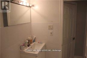 Toronto (University) apartment for rent - A bathroom with a sink and mirror.