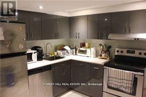 Toronto (University) apartment for rent - A kitchen with Forest Hill Real Estate Inc. Brokerage written on the wall.