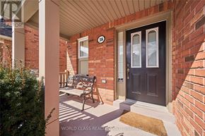 Ajax (Northeast Ajax) apartment for rent - A house number 38 with a brown door and a bench outside.