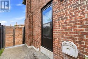 Vaughan (East Woodbridge) apartment for rent - A brick wall with a mailbox and a window.