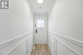Vaughan (East Woodbridge) apartment for rent - A hallway with a white door and walls.