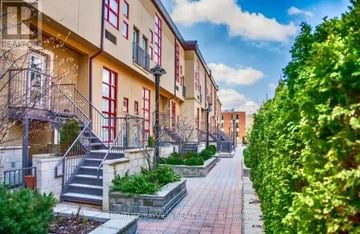 Toronto (North St. James Town) townhouse for rent - A row of apartment buildings with a walkway between them.