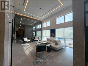 Oakville (Go Glenorchy) condo for rent - A spacious living room with a large window and a view of the city.