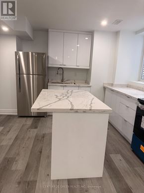 Milton (Cb Cobban) apartment for rent - A kitchen with a marble countertop and stainless steel appliances.