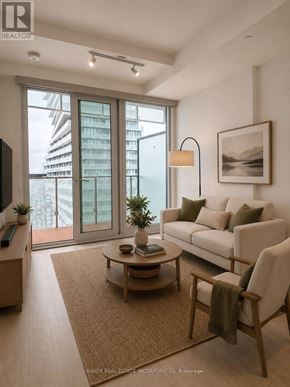 Mississauga (City Centre) condo for rent - A living room with a couch, chair, and a table with a plant on it.