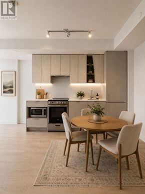 Mississauga (City Centre) condo for rent - A modern kitchen with a dining table set for four.