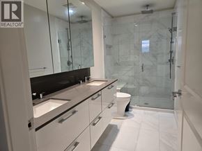 Vancouver apartment for rent - A bathroom with a walk-in shower and a toilet.