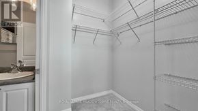 Mississauga (City Centre) condo for rent - A white walk in closet with shelves and a door.