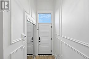 Vaughan (East Woodbridge) apartment for rent - A hallway with white walls and a white door.