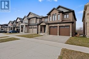 Cambridge apartment for rent - A row of houses with the logo HOMELIFE/MIRACLE REALTY LTD, Brokerage in the bottom left corner.