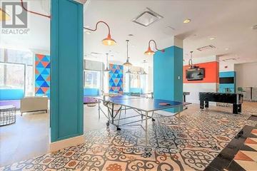 Ottawa condo for rent - A room with a pool table and a television.