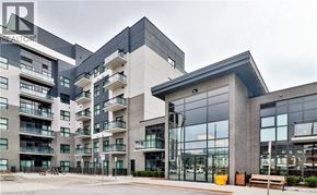 Oakville condo for rent - A modern building with glass windows and a sign that reads "REALTOR".