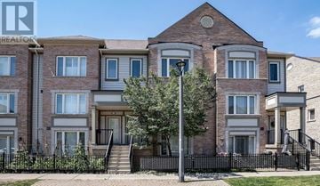 Mississauga (Churchill Meadows) townhouse for rent - A row of townhouses with a black fence in front.