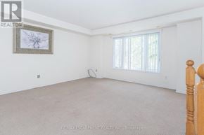 Mississauga (Churchill Meadows) townhouse for rent - A room with a carpeted floor and a picture frame on the wall.