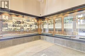 Toronto (Kensington-Chinatown) condo for rent - A wall of glass panels with information on them.