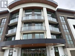 Oshawa (Windfields) condo for rent - A building with a sign that says "HOMELIFE/MIRACLE REALTY LTD. Brokerage".