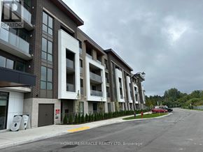 Oshawa (Windfields) condo for rent - A building with the sign "HOMELIFE/MIRACLE REALTY LTD, Brokerage" on the side of it.