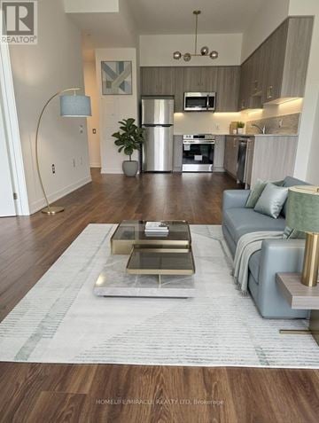 Oshawa (Windfields) condo for rent - A living room with a coffee table in the middle of the room.