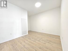 Guelph (Willow West/Sugarbush/West Acres) condo for rent - A room with wooden flooring and white walls.