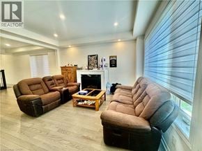 Kitchener apartment for rent - A living room with a fireplace and a dog.