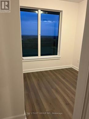 Oakville (Jm Joshua Meadows) condo for rent - A room with a window overlooking the ocean.