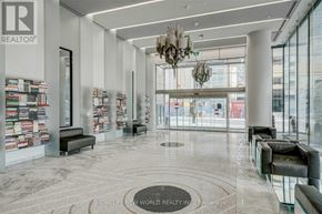 Toronto (Mount Pleasant West) condo for rent - A spacious lobby with a marble floor and a chandelier hangs from the ceiling.