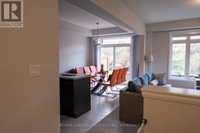 Niagara Falls (Cherrywood) house for rent - A living room with a couch, chairs, and a cabinet.