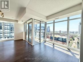 Toronto (Moss Park) condo for rent - A room with a view of the city through large windows.