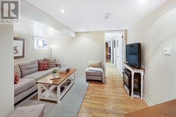 Toronto (Birchcliffe-Cliffside) apartment for rent - A living room with a grey couch and a wooden coffee table.