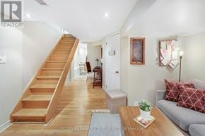 Toronto (Birchcliffe-Cliffside) apartment for rent - A living room with a couch, coffee table, and stairs.