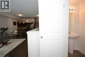 Oakville townhouse for rent - A white door is open to a bathroom.