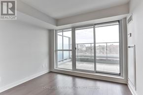 Toronto (Yonge-Eglinton) condo for rent - A room with a large window and a sliding glass door.