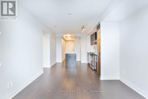 Toronto (Yonge-Eglinton) condo for rent - A spacious, empty room with wooden floors and white walls.