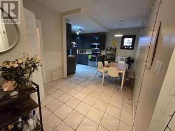 Toronto (Annex) multi-family for rent - A kitchen with a dining table and chairs.