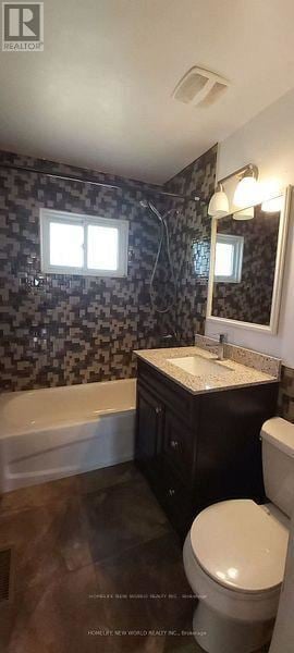 Belleville (Thurlow Ward) apartment for rent - A bathroom with a black and white tiled shower and a white toilet.