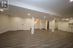 Toronto (Bendale) apartment for rent - A spacious room with wooden flooring and white walls, ready for a new tenant.