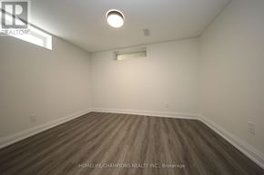 Toronto (Bendale) apartment for rent - A room with wooden flooring and white walls.
