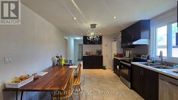 Markham (Grandview) apartment for rent - A kitchen with a dining table and chairs in the foreground.