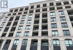 Markham (Unionville) condo for rent - A tall building with many windows and balconies, with the words "ROYAL LEASE PARK" visible on the facade.