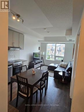 Markham (Unionville) condo for rent - A kitchen with a dining table and chairs.