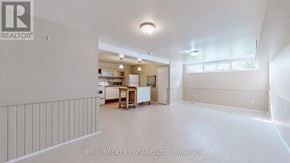 Richmond Hill (Crosby) apartment for rent - A spacious empty room with a kitchen area in the background.