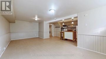 Richmond Hill (Crosby) apartment for rent - A spacious room with a kitchenette in the background.