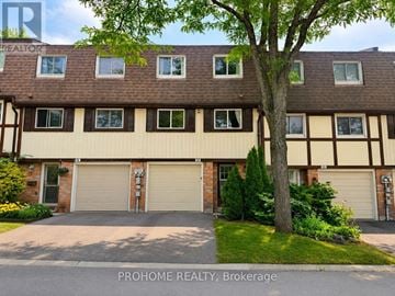 Markham (Bullock) townhouse for rent - A building with a tree in front of it.