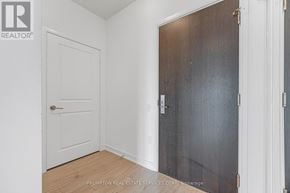Mississauga (Hurontario) condo for rent - A white door is on the left and a brown door is on the right.