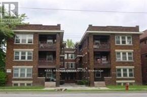 Hamilton (Crown Point) multi-family for rent - A building with the sign Real Estate on it.