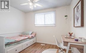 Haldimand apartment for rent - A bedroom with a bed, desk, and chair.