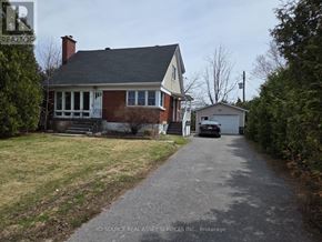 Ottawa apartment for rent - A house with a driveway in front of it.